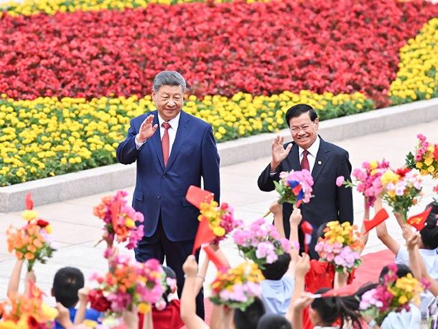 习近平同老挝人民革命党中央总书记、国家主席通伦举行会谈